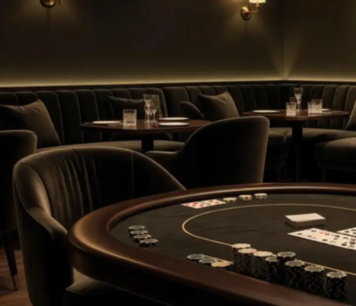 Card lounge with poker table, bar service and ambient evening lighting at ADSIGHT LTD