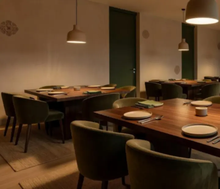 Timber tables and soft lighting in the dining room at ADSIGHT LTD